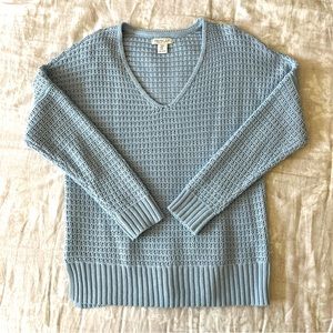 Open weave light blue cotton v-neck sweater.
